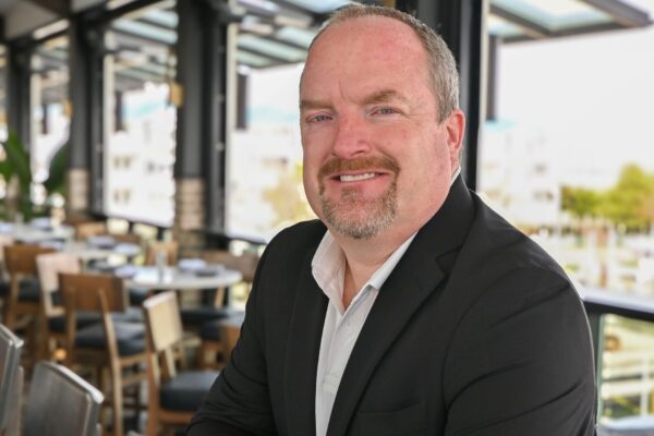 a man sitting at a table in a restaurant