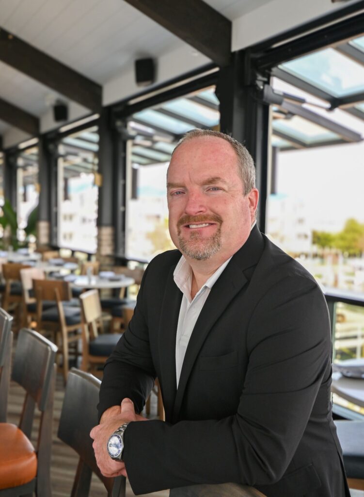 a man sitting at a table in a restaurant