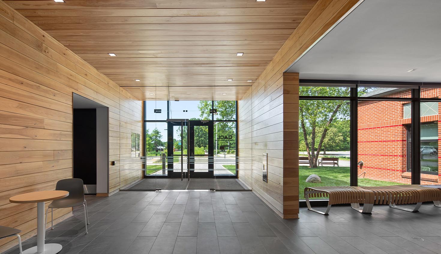 a long hallway with wooden walls and flooring