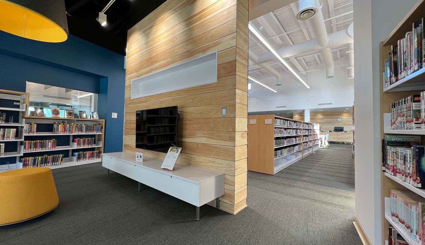 a library filled with lots of books and a television