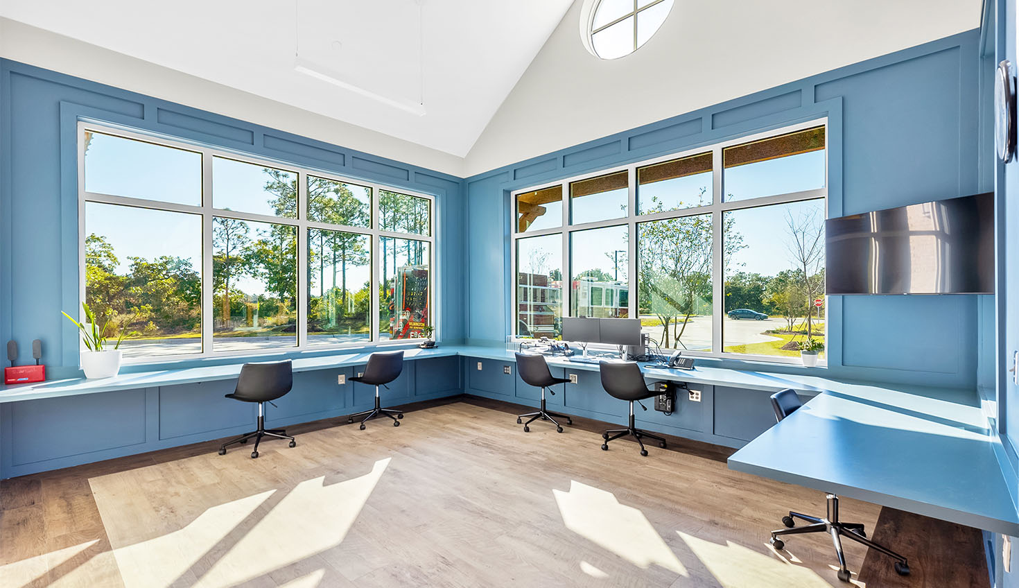 a room with blue walls and wooden floors