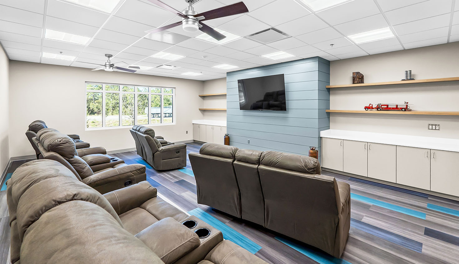 a large room with couches and a flat screen tv