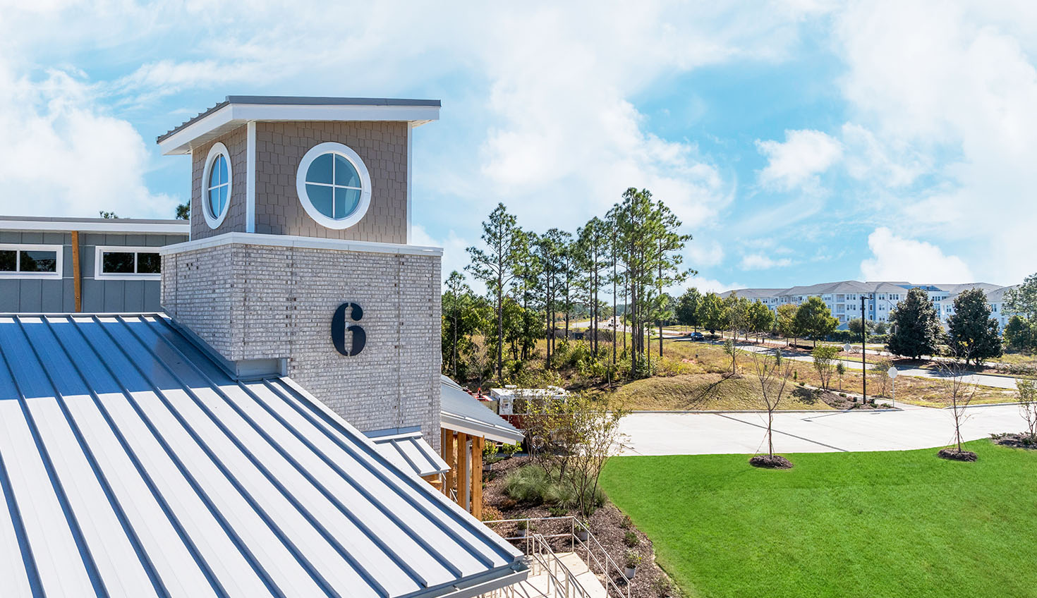 a building with a metal roof and a clock tower