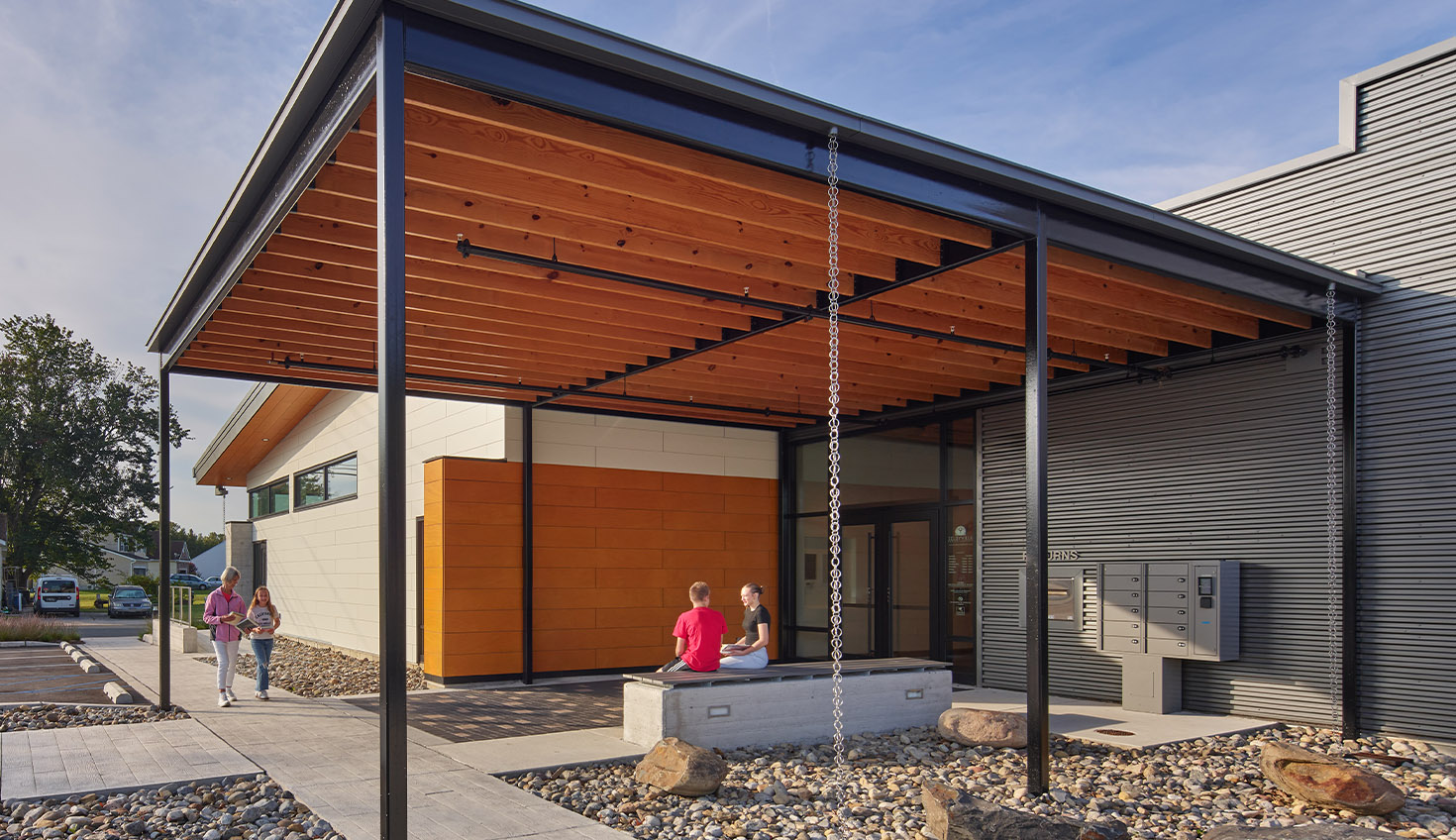 a couple of people standing outside of a building