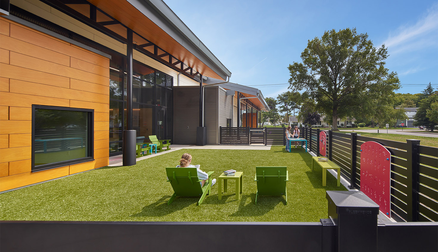 a person sitting in a chair on the grass