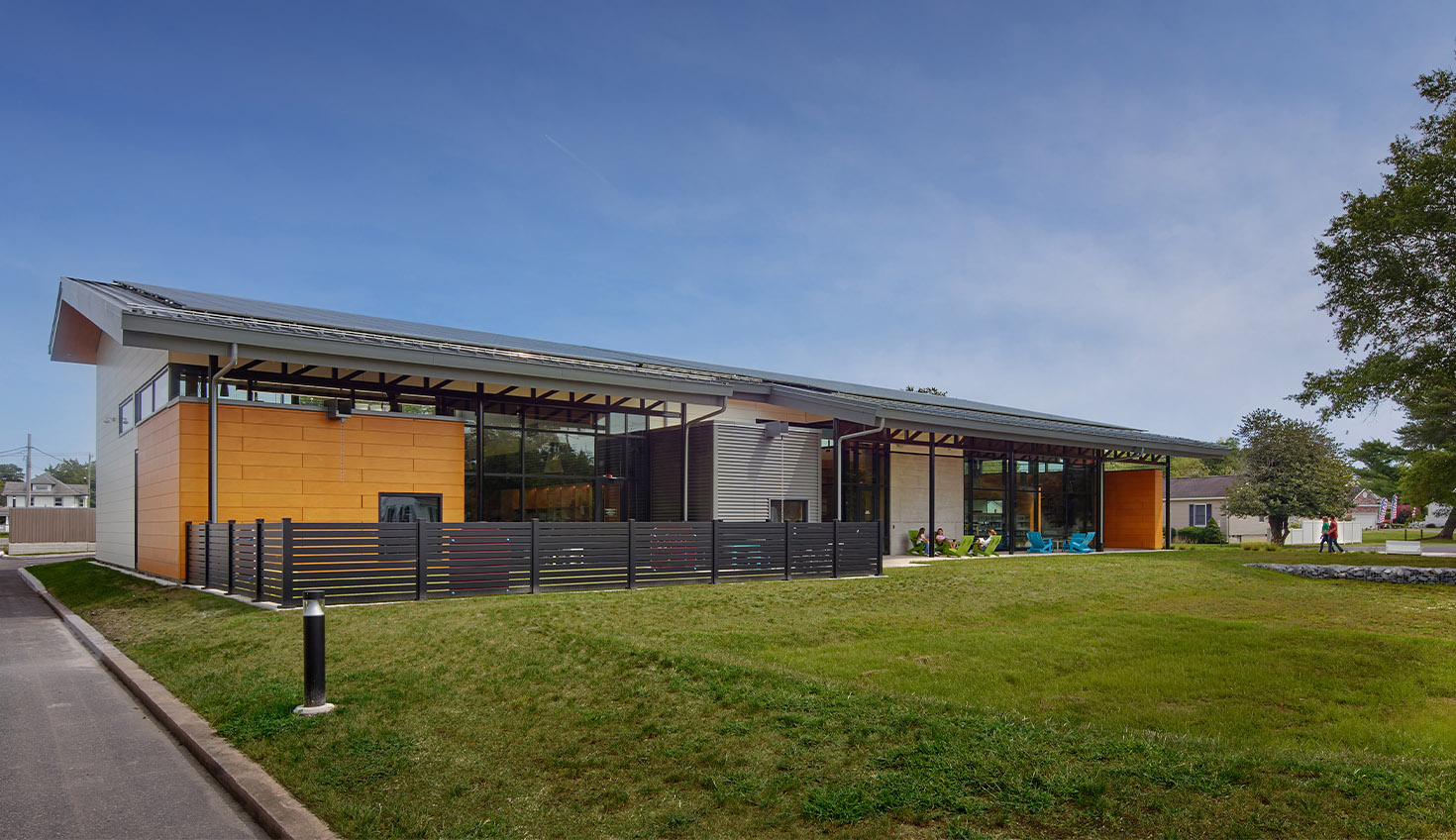 a building with a grassy field in front of it