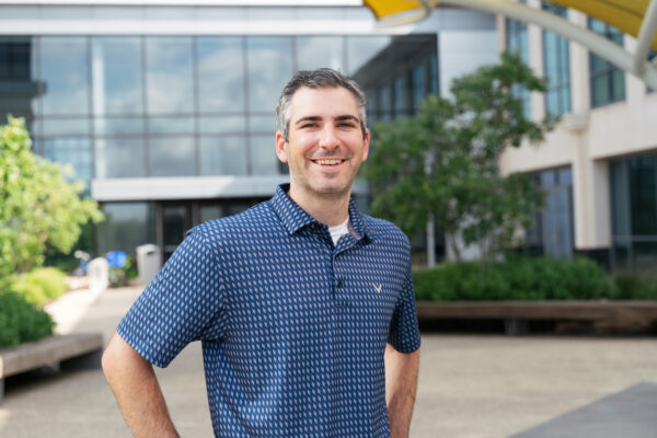 a man standing in front of a building