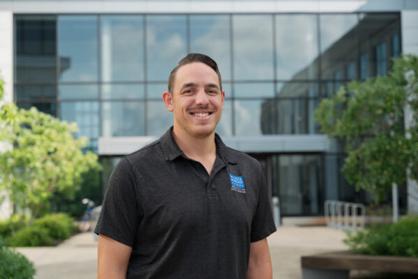 a man standing in front of a building
