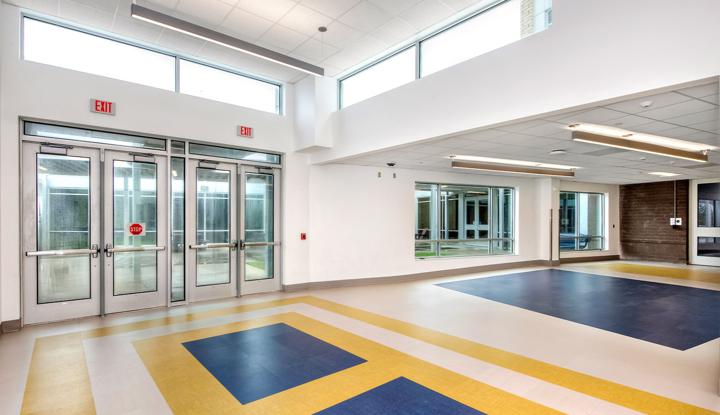 a large open room with a lot of windows