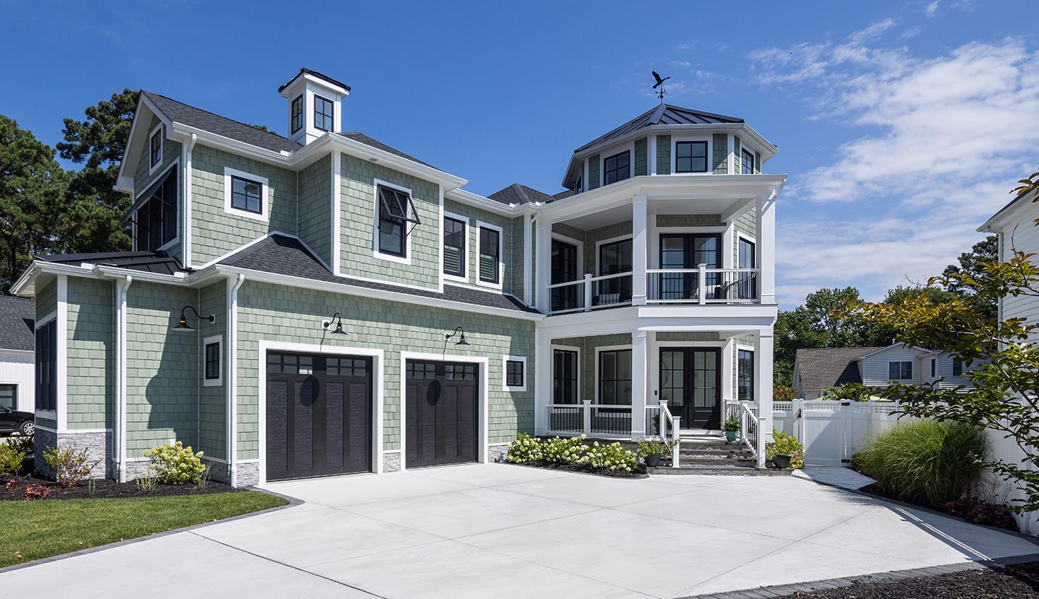 a two story house with a large driveway