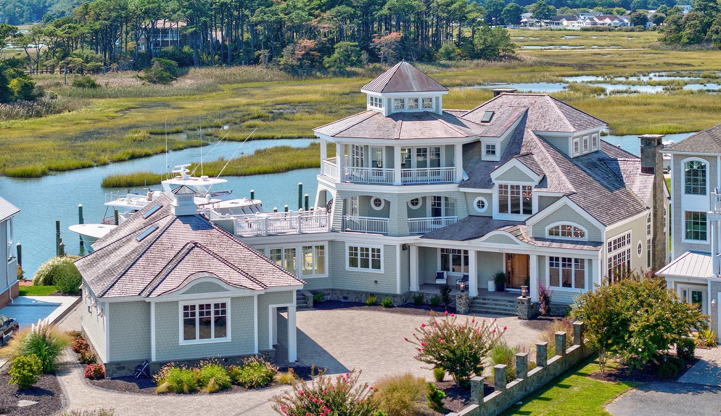 an aerial view of a large white house