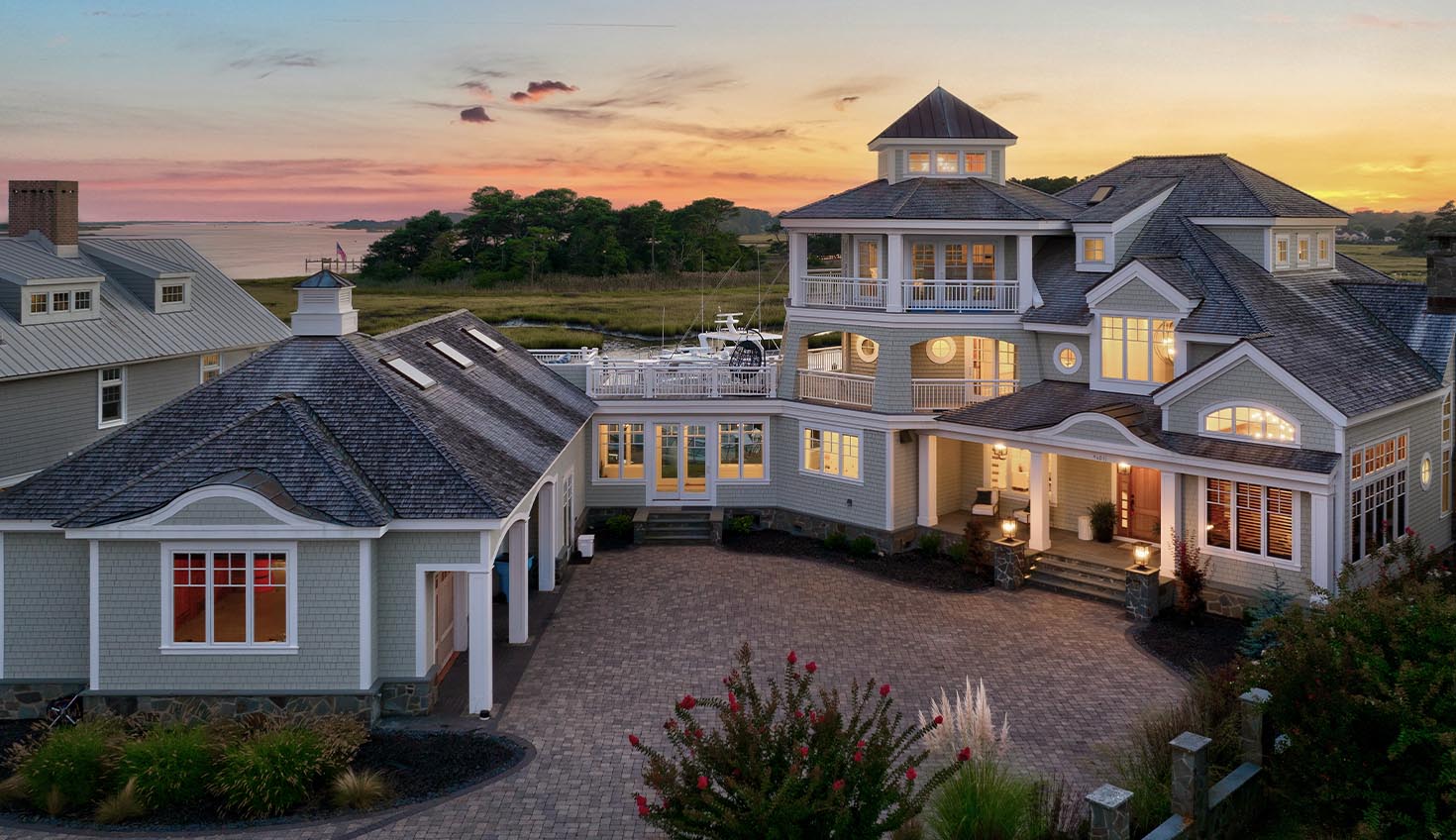 an aerial view of a house at sunset