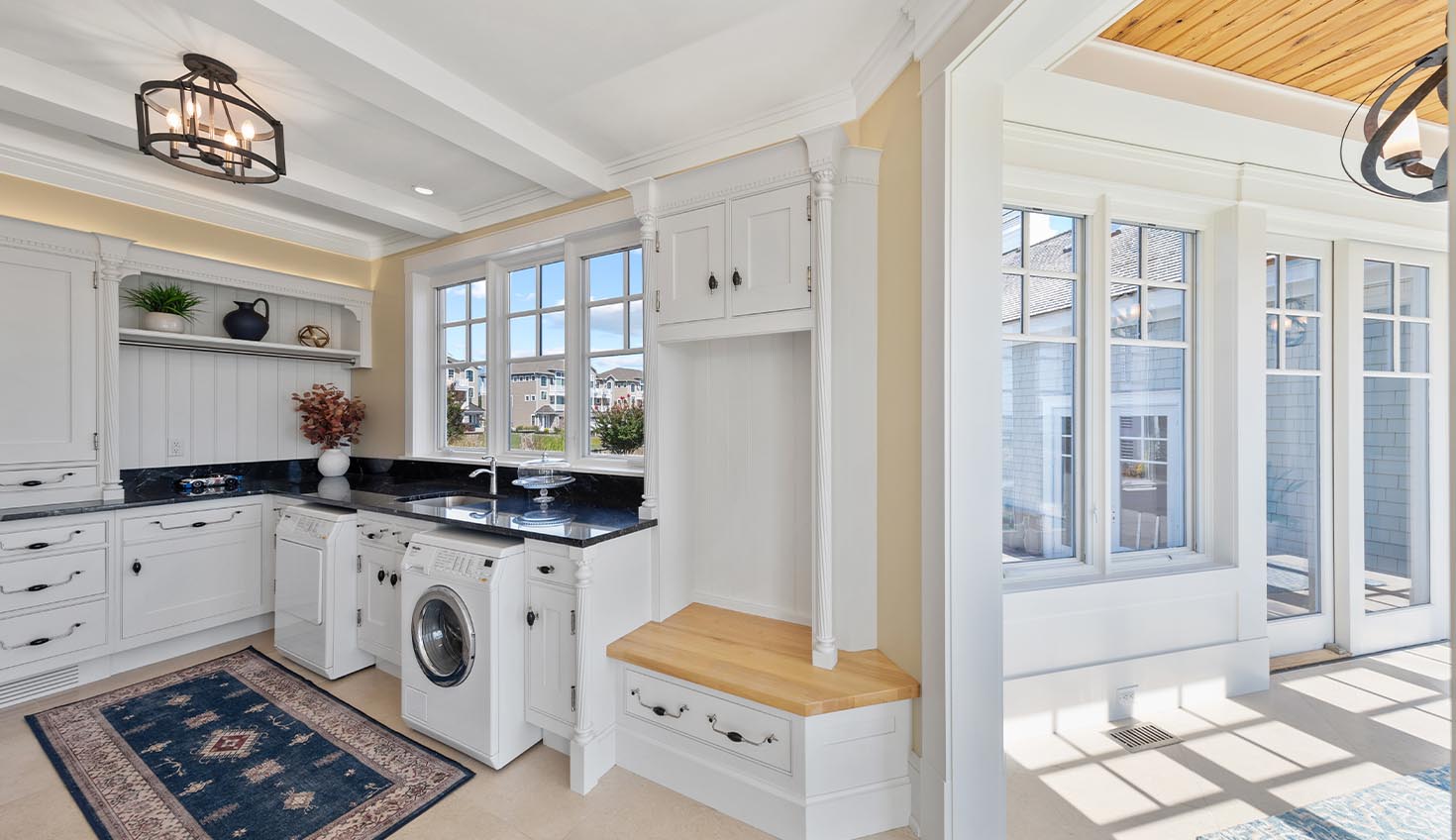 a large kitchen with a washer and dryer in it