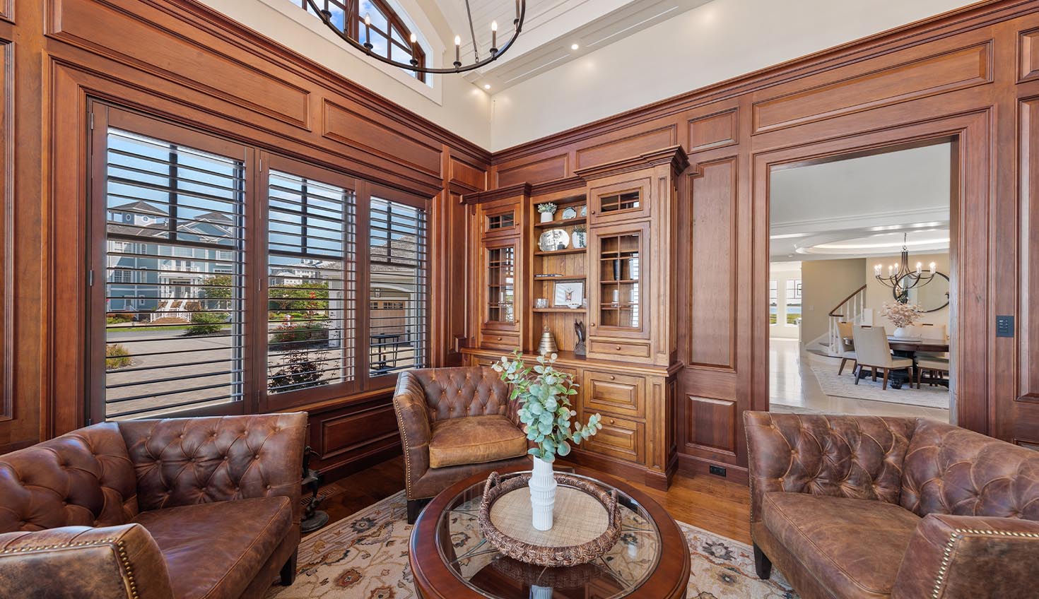 a living room filled with furniture and a chandelier