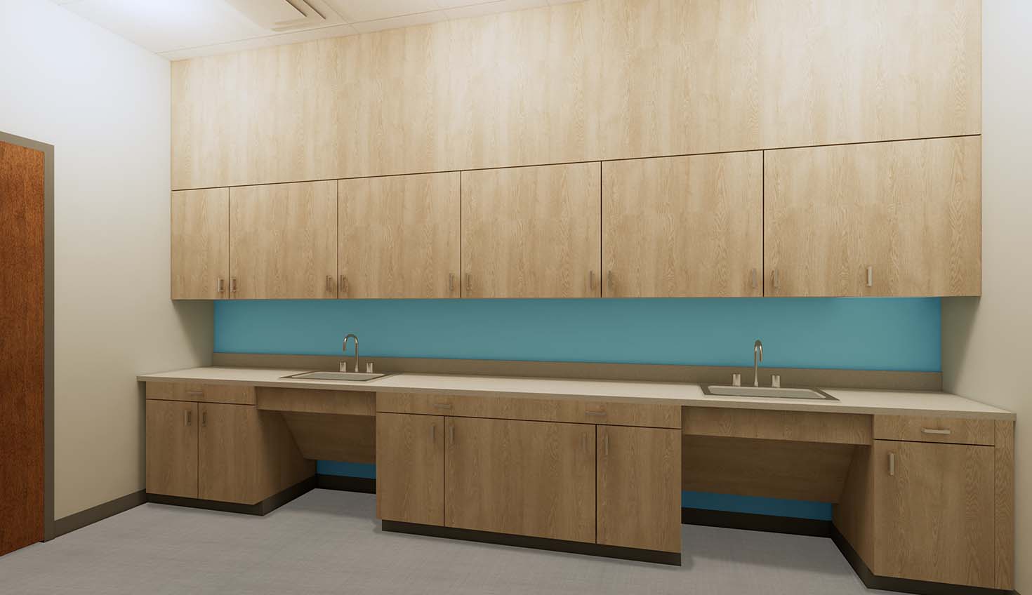 an empty room with two sinks and cabinets