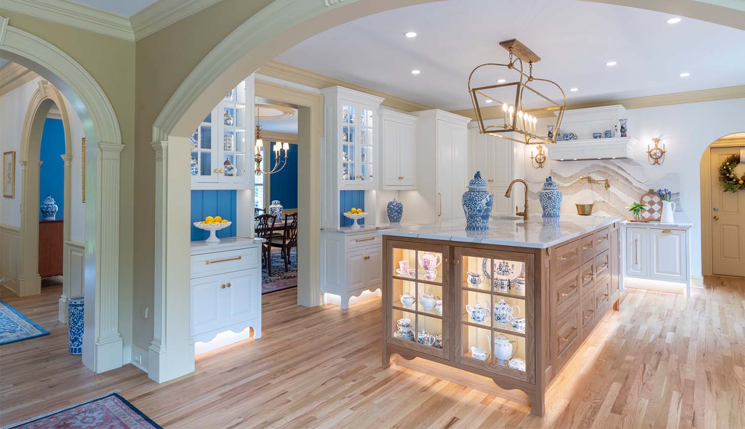a large kitchen with a center island in the middle of the room