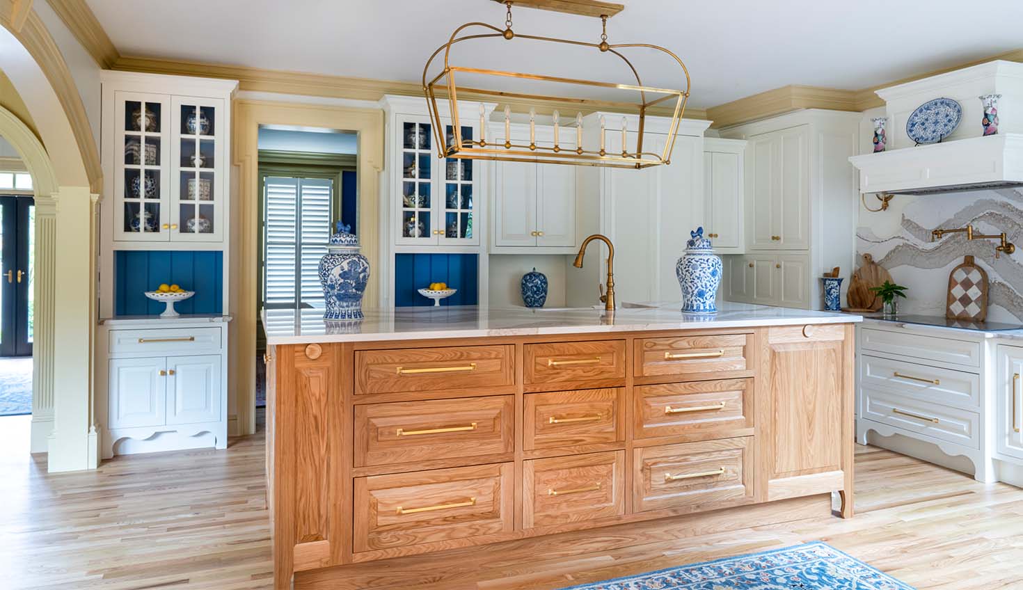 a large kitchen with a center island in the middle of the room