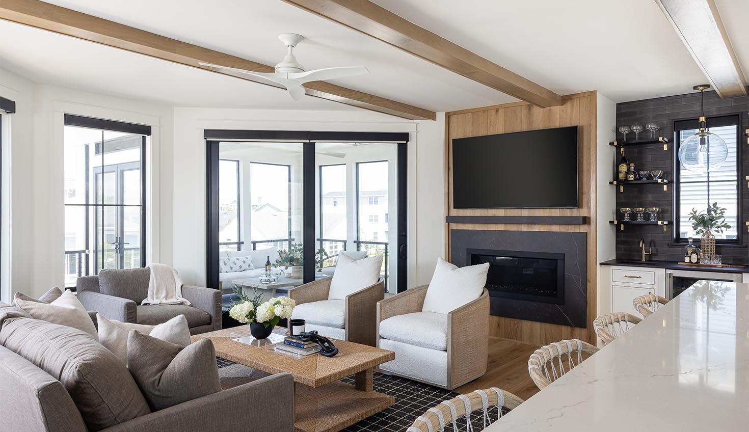a living room filled with furniture and a flat screen tv