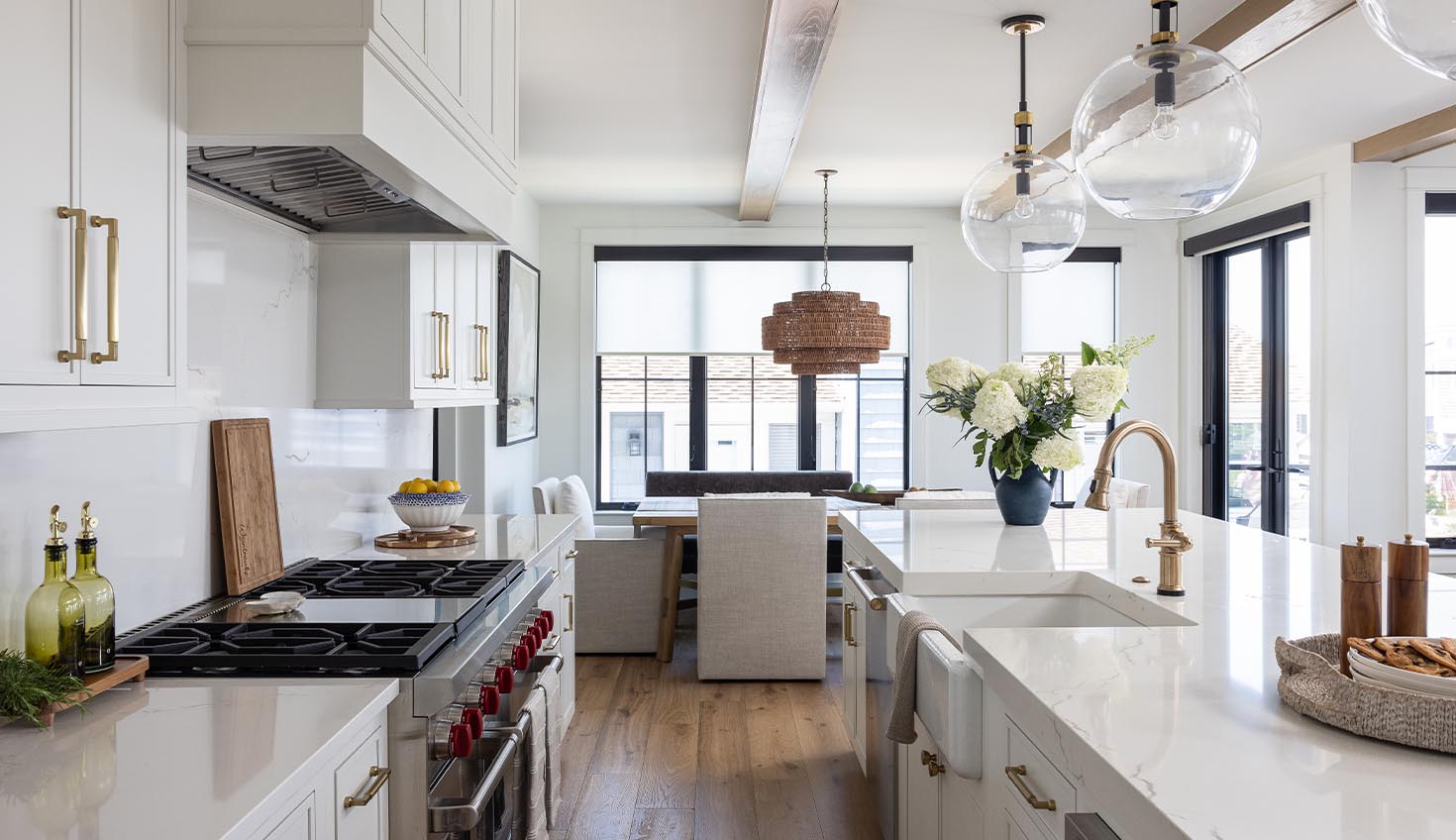 a kitchen with white cabinets and a wooden floor
