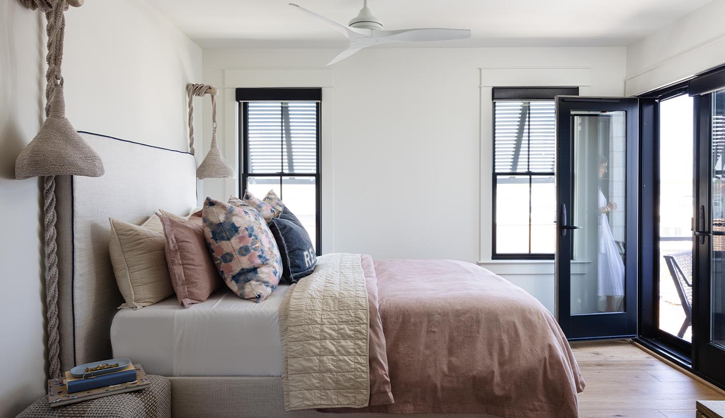 a bedroom with a bed and a balcony