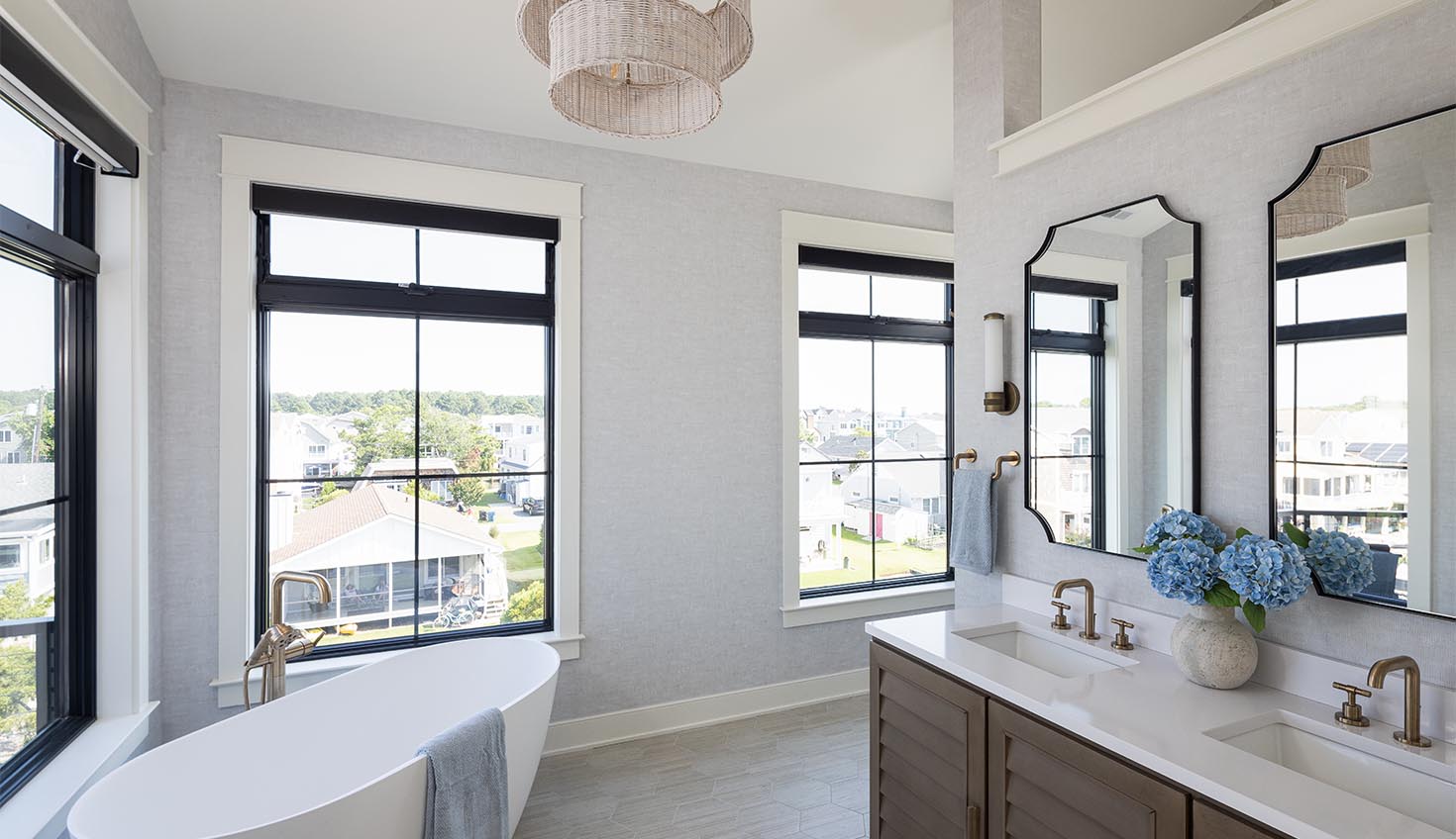 a large bathroom with two sinks and a tub