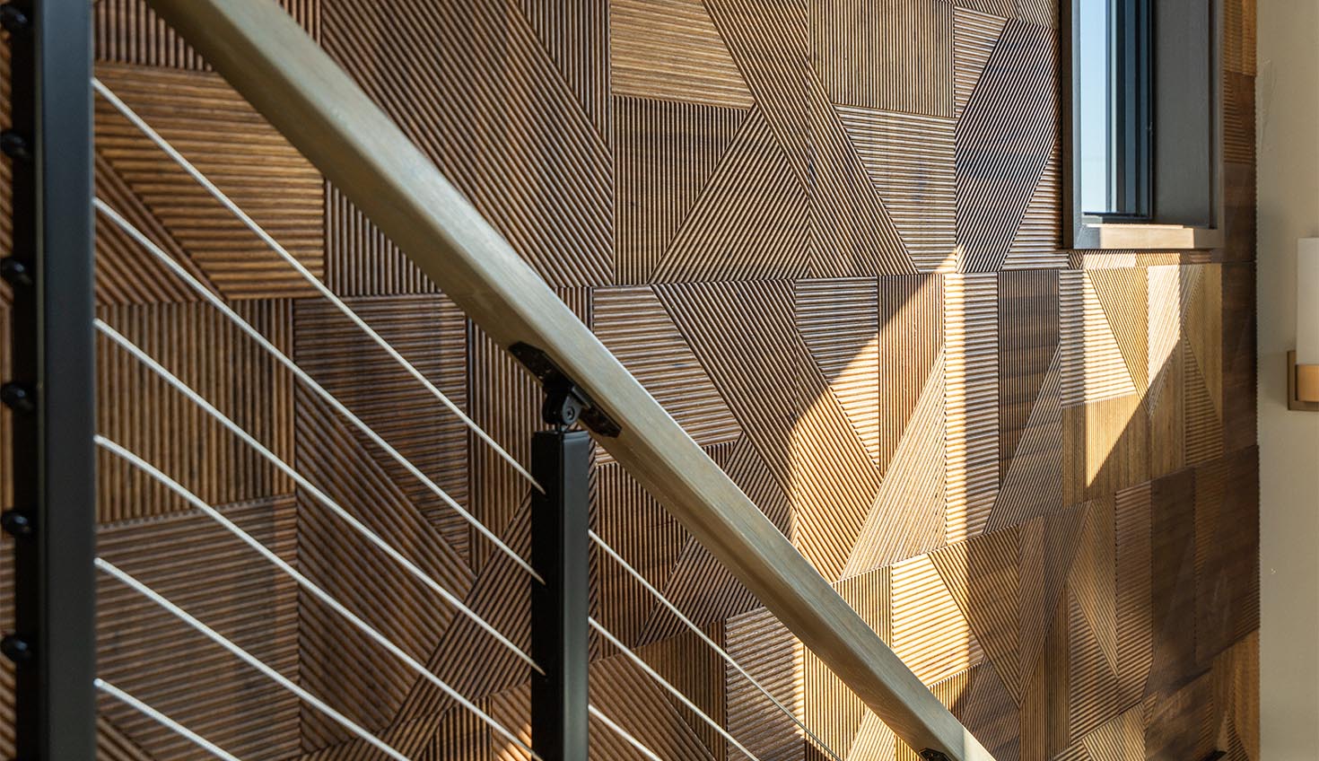 a wooden wall with a metal hand rail
