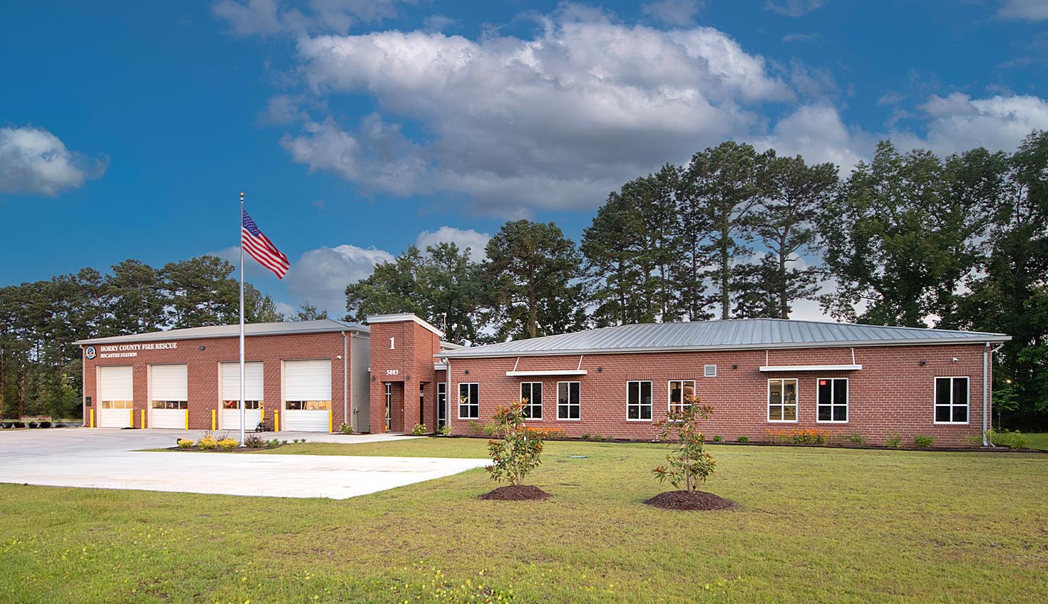 a red brick building with a flag on top of it