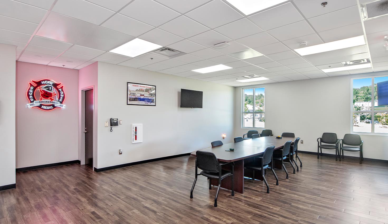 a conference room with a large table and chairs
