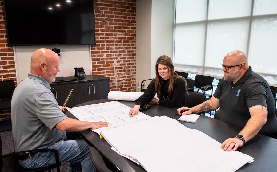 a group of people sitting around a table