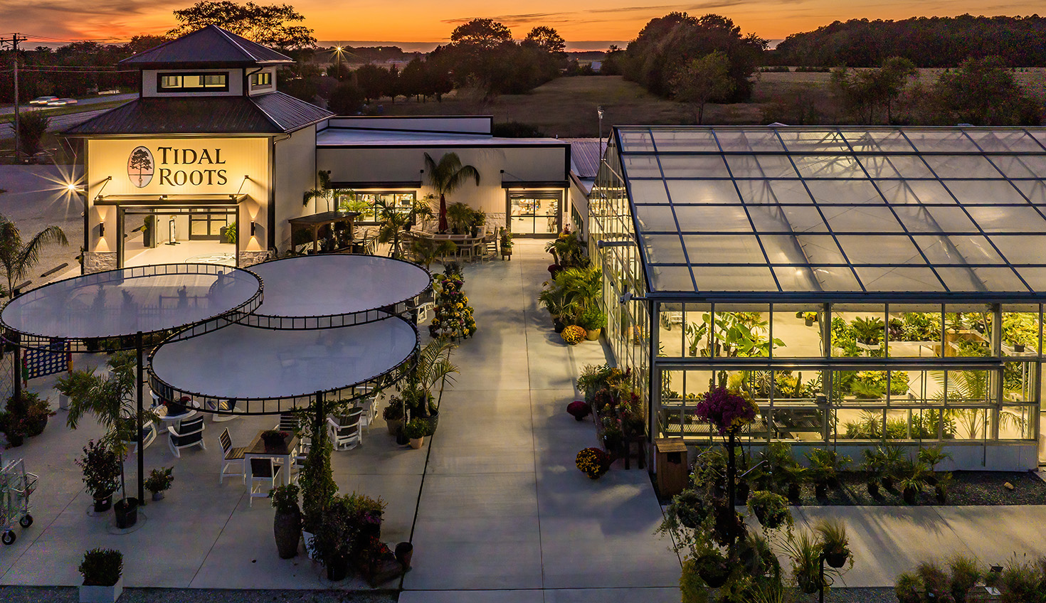 an aerial view of a building at sunset