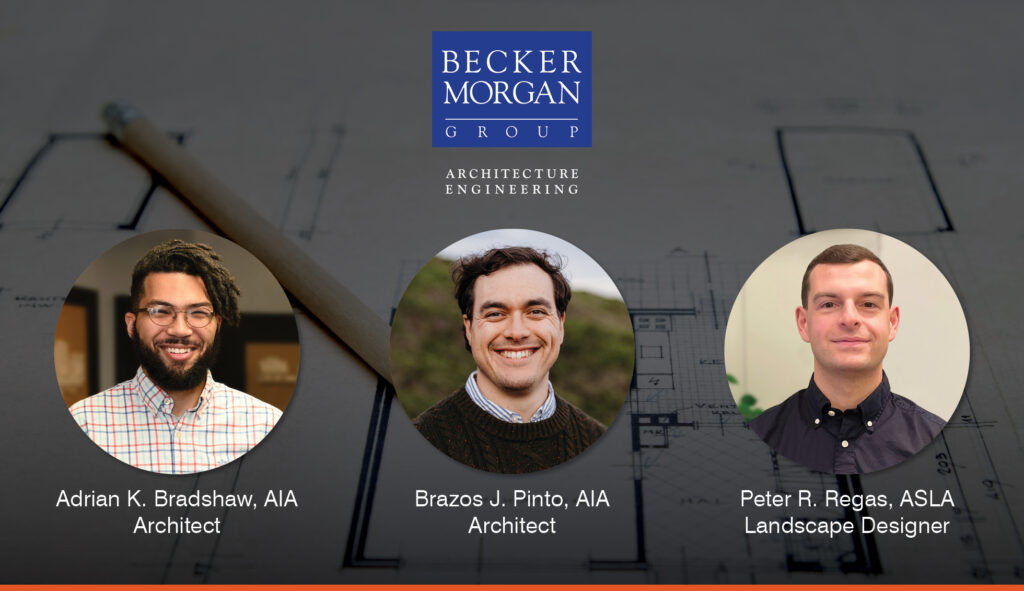 a group of three men standing next to each other