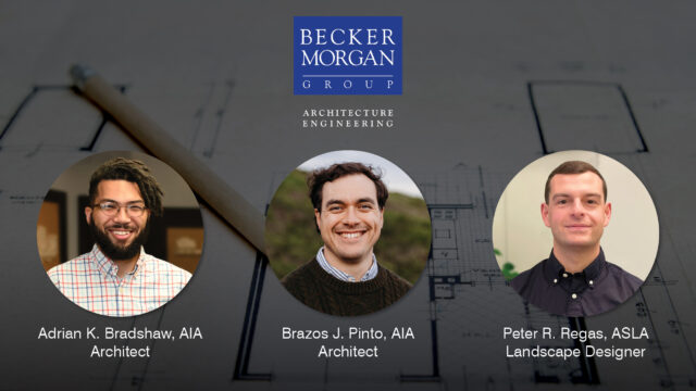 a group of three men standing next to each other