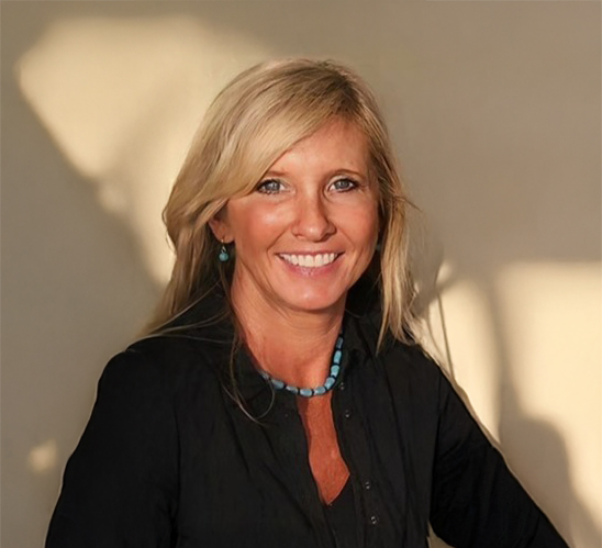 a woman in a black shirt is smiling