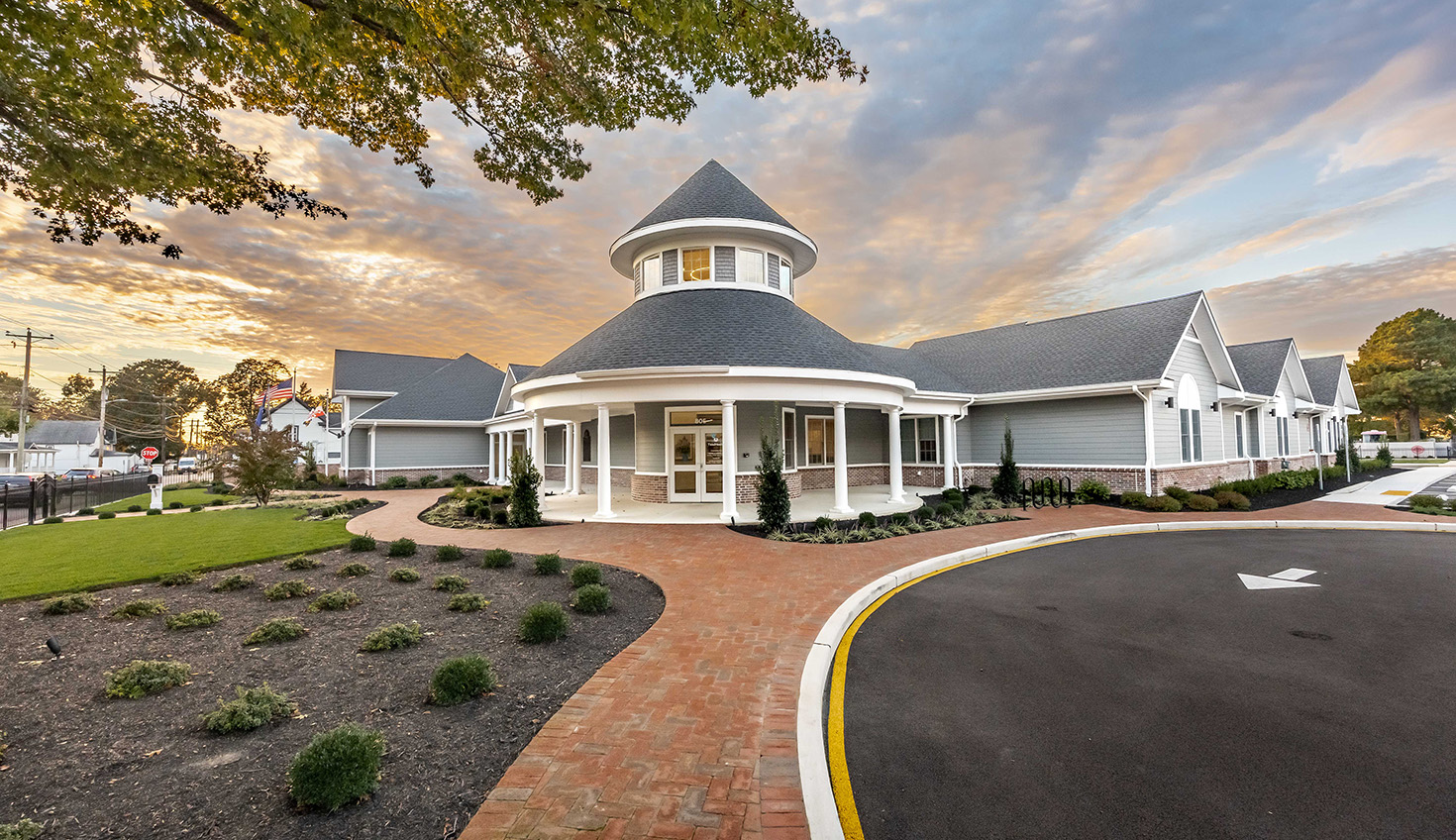 a large white house with a large driveway