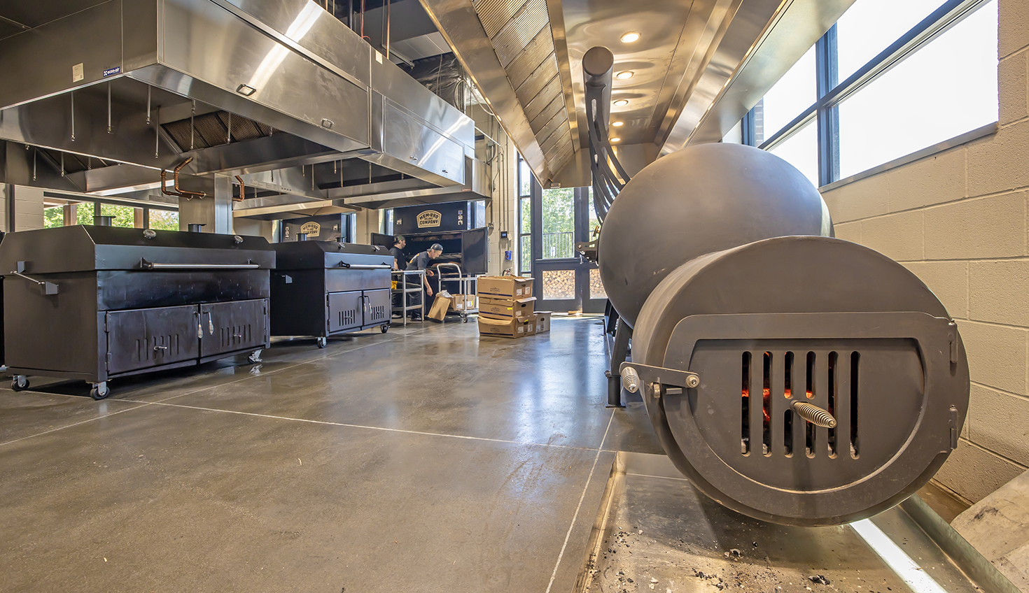 a large industrial kitchen with a large stove